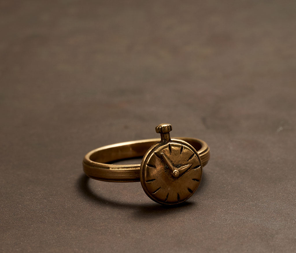 ring symbol clock gold