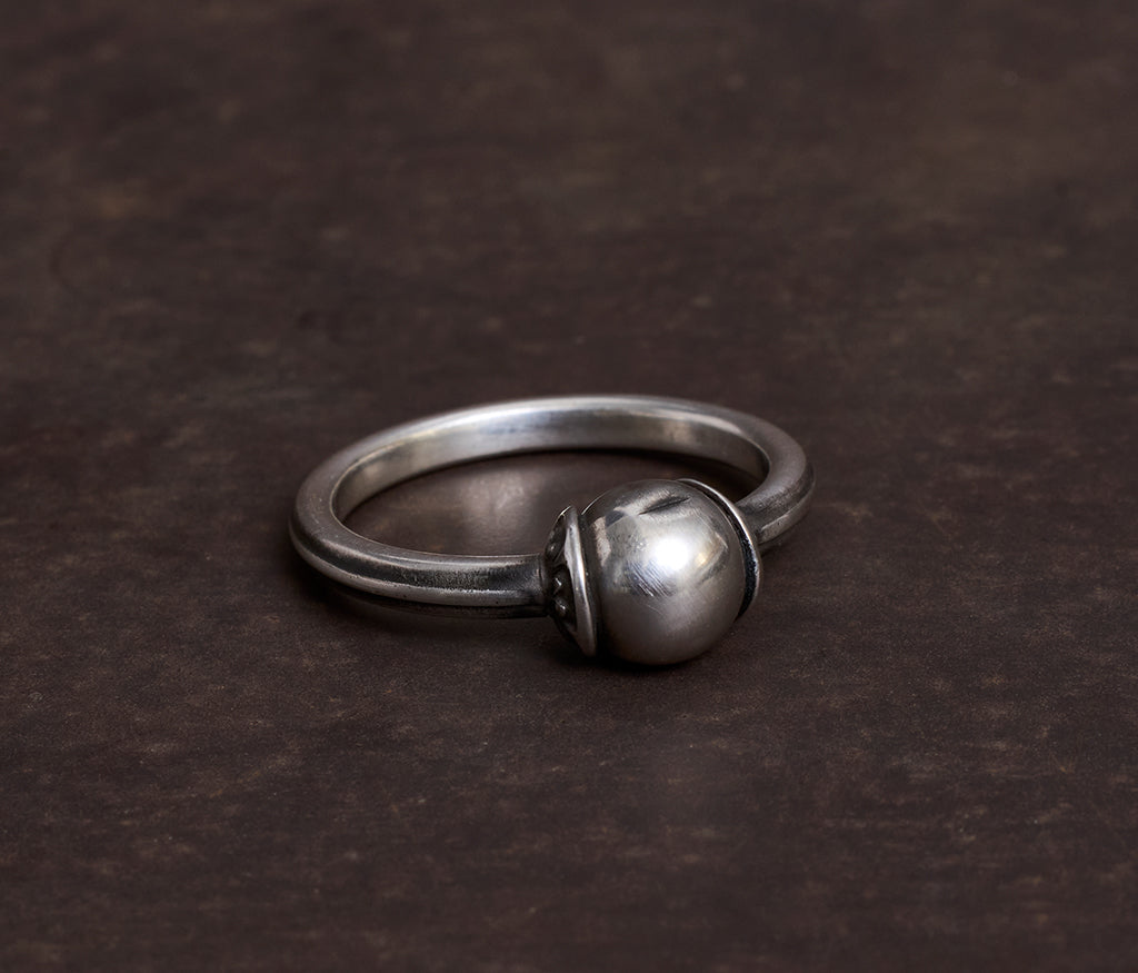 ring symbol pearl