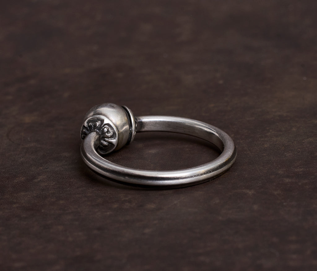 ring symbol pearl