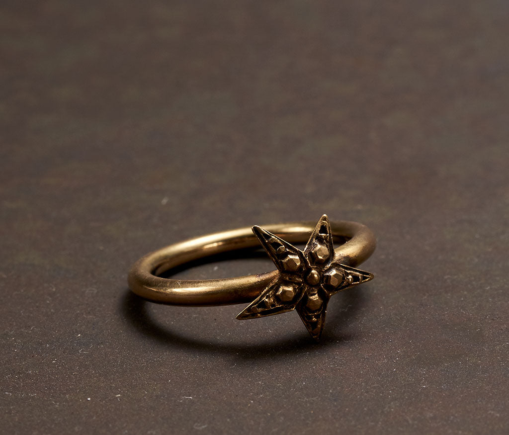 ring symbol star gold