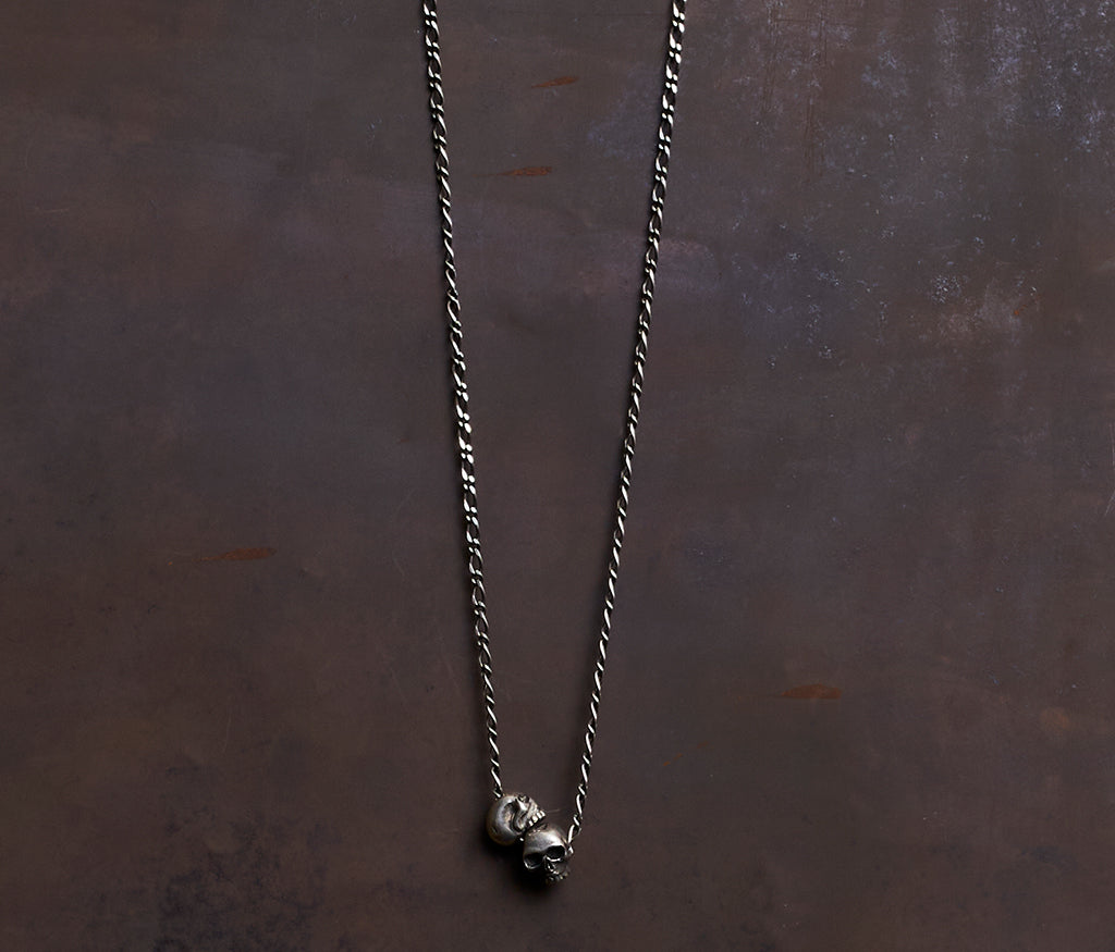necklace two skulls