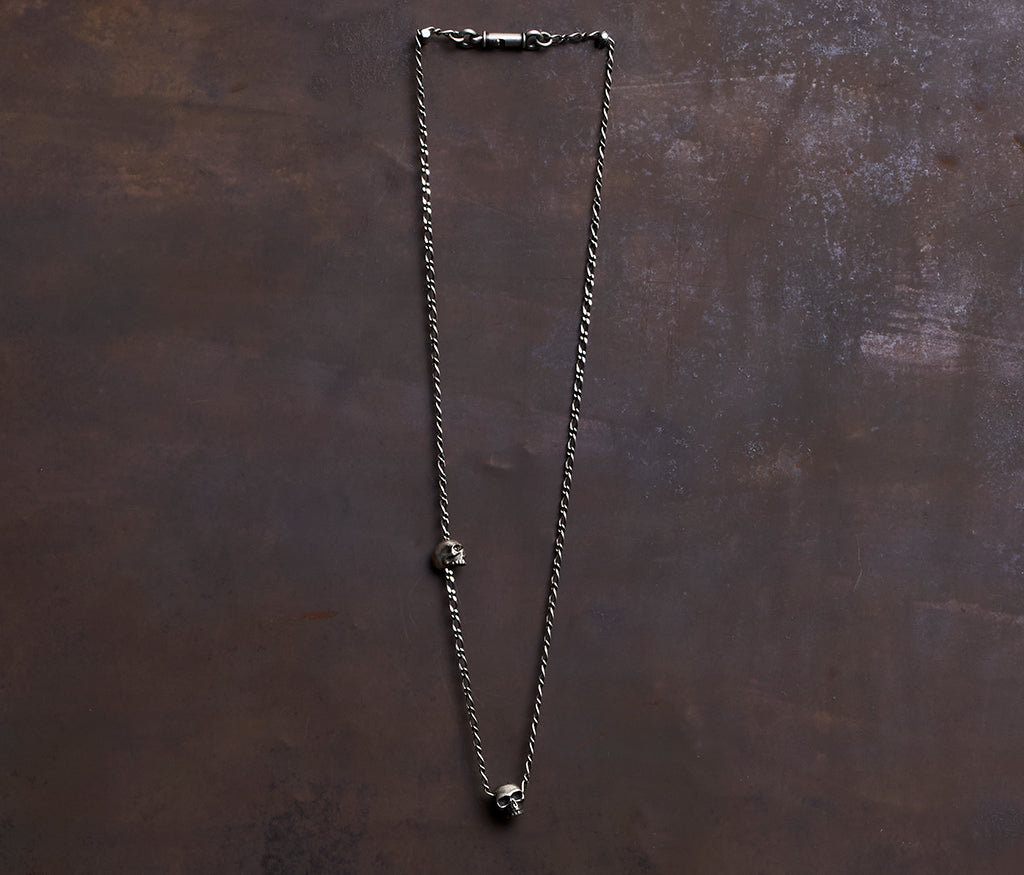 necklace two skulls