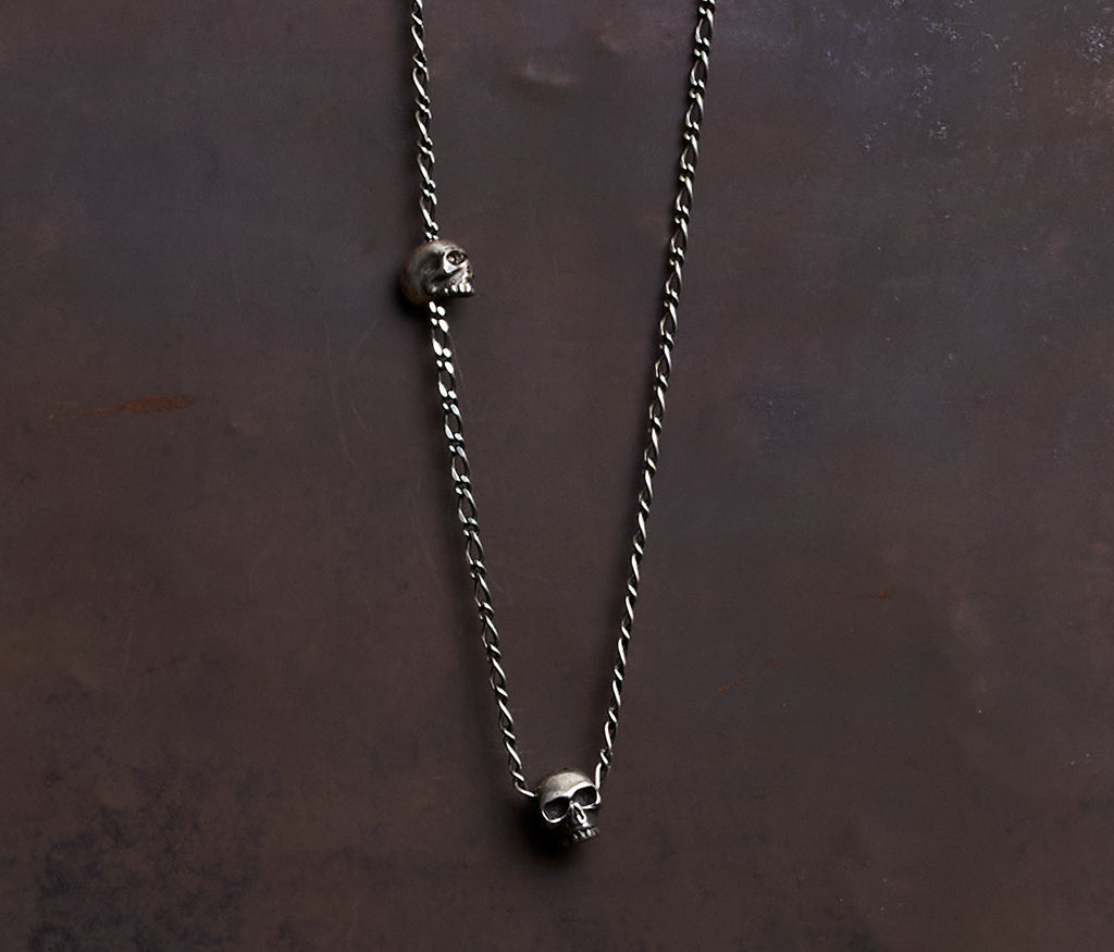 necklace two skulls